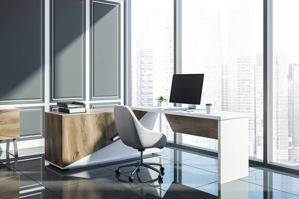 Stylish manager office interior with wooden computer table standing on a tiled floor in a gray panel room. Loft window. A side view. 3d rendering mock up - Photo, Image