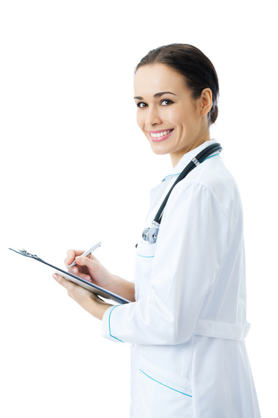 Happy smiling female doctor writing on clipboard, isolated on wh - 写真・画像