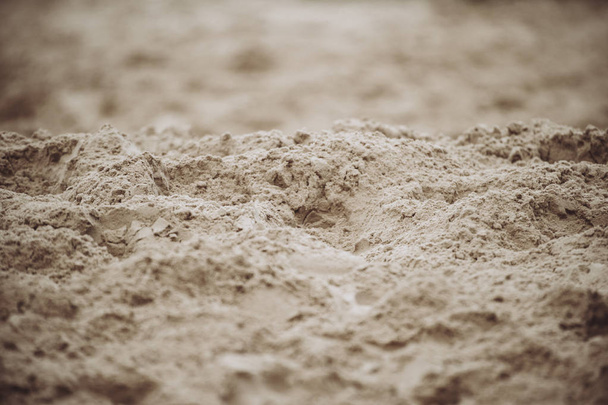Nahaufnahme des Sandmusters eines Strandes im Sommer - Foto, Bild