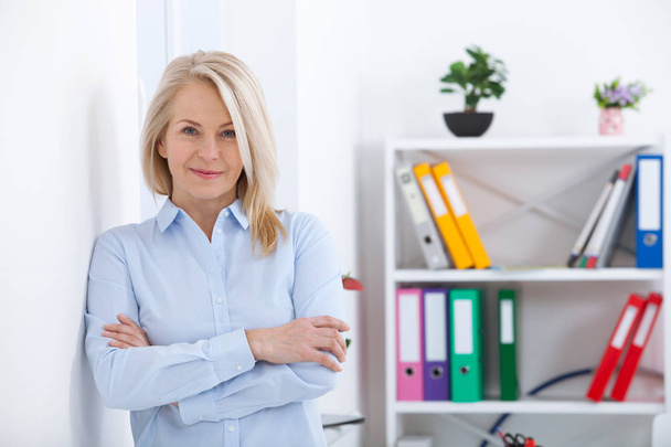 Portrait of beautiful middle aged businesswoman in office. - Photo, Image