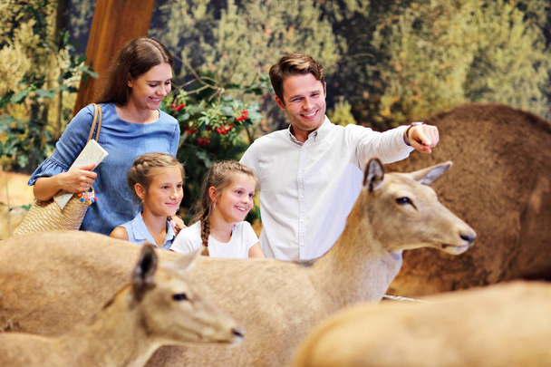 Joyful family in nature museum - Foto, Imagen