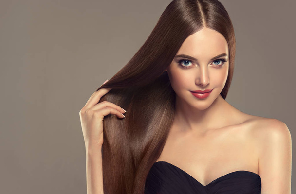 Beautiful model girl with shiny brown and straight long hair . Keratin straightening . Treatment, care and spa procedures. Medium length hairstyle.  - Photo, Image