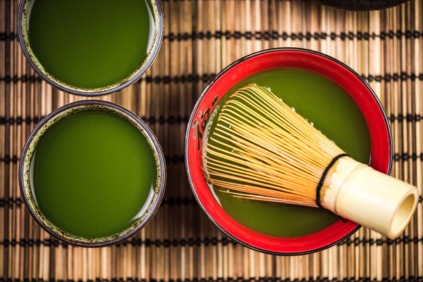 Green Matcha tea in japanese bowls, top view - Photo, Image