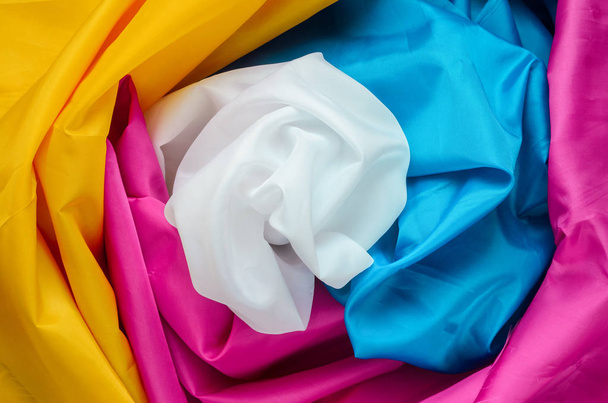 Multicolor Four Different Colors Synthetic Lining Fabric with Folds Background - 写真・画像