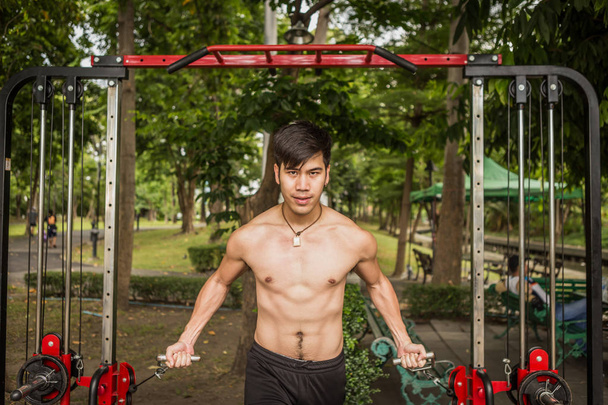A young sportsman getting ready for athletic and fitness training outdoors. Healthy lifestyle concept with sunrise early morning. - Photo, Image