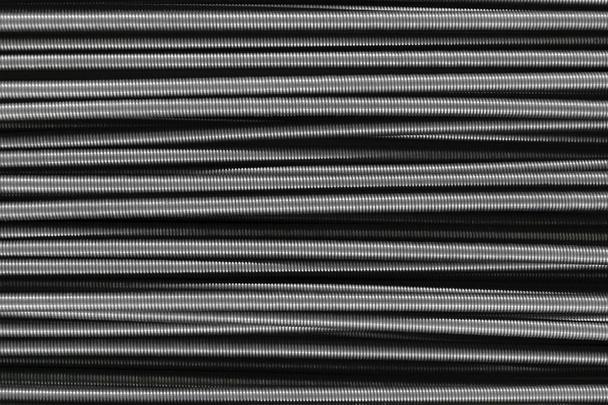 Многие горизонтально расположенные металлические пружины фоновая поверхность
 - Фото, изображение