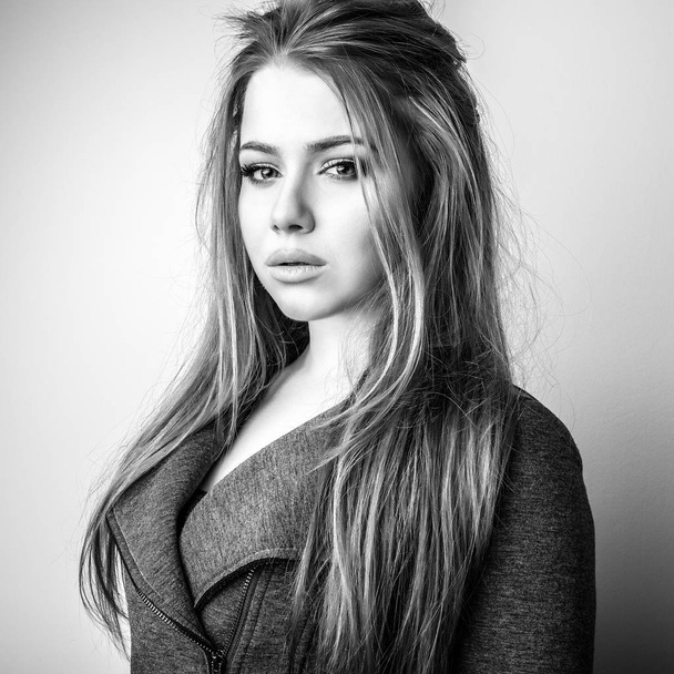 Young beautiful woman black-white studio portrait. - Foto, imagen