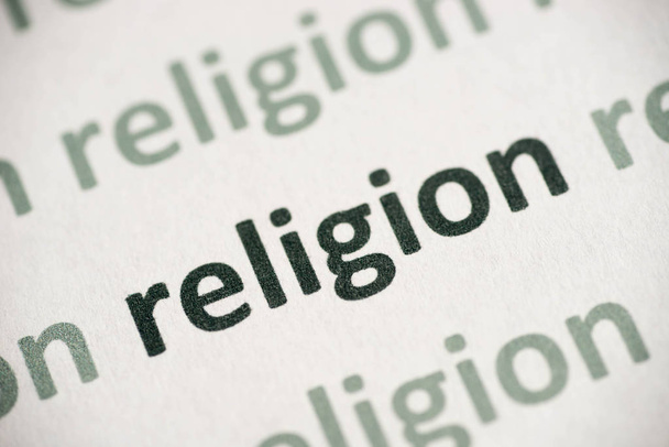 word religion printed on white paper macro - Photo, Image