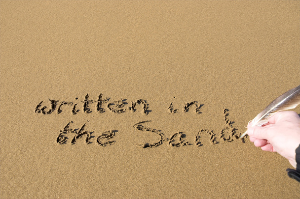 mano escrita en la arena
 - Foto, imagen