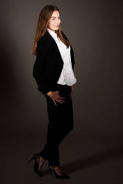 attractive business woman - full length corporative portrait islated over gray background - Foto, Bild