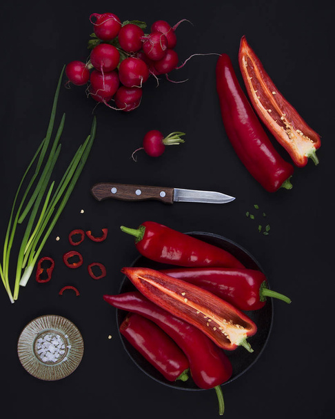 Fresh red pepper on black table - Фото, зображення