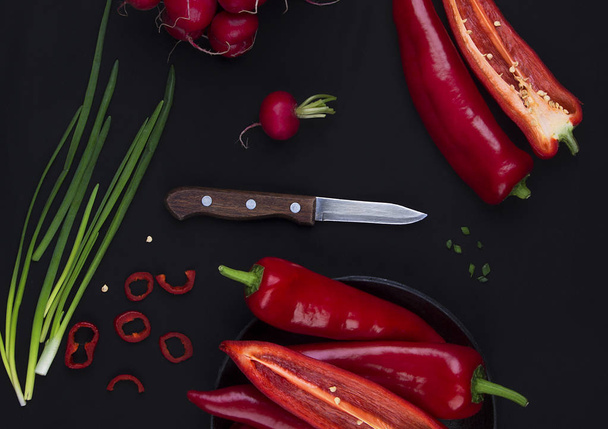 Fresh red pepper on black table - Foto, Imagen
