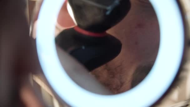Man Shaving Face With Trimmer In Mirror Close Up  - Кадри, відео