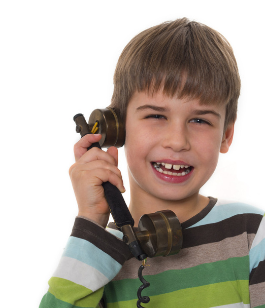 jonge jongen door oude, vintage telefoon bellen - Foto, afbeelding