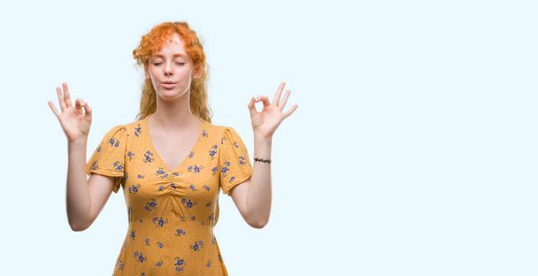 Young redhead woman relax and smiling with eyes closed doing meditation gesture with fingers. Yoga concept. - Φωτογραφία, εικόνα