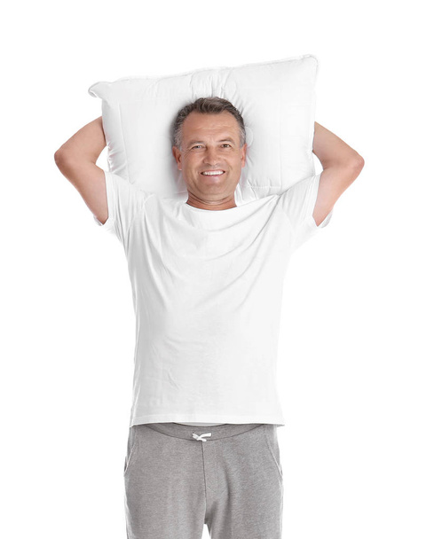 Man holding soft pillow on white background - Foto, Imagem