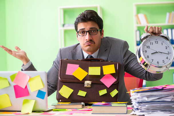 Businessman unhappy with many conflicting priorities sitting in  - Photo, Image