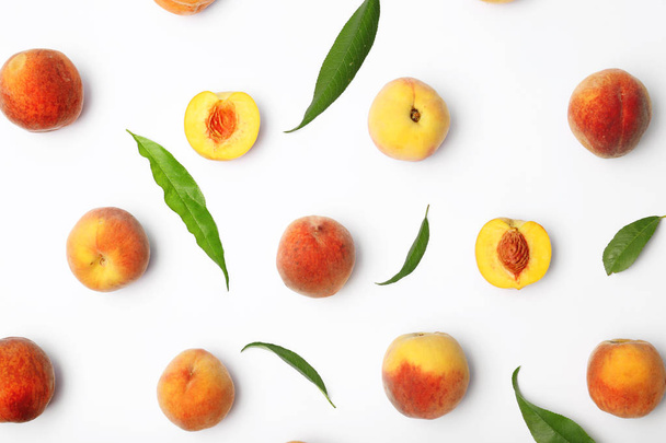 Composition with fresh sweet peaches on white background - Zdjęcie, obraz