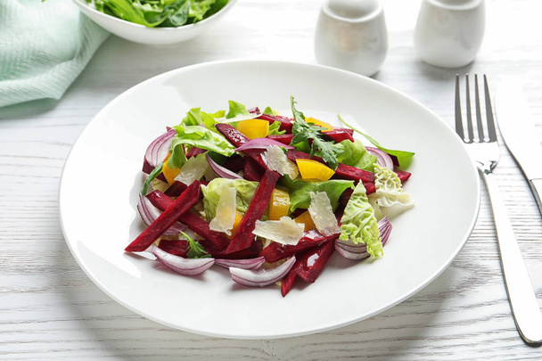 Plate with delicious beet salad served on table - Photo, Image