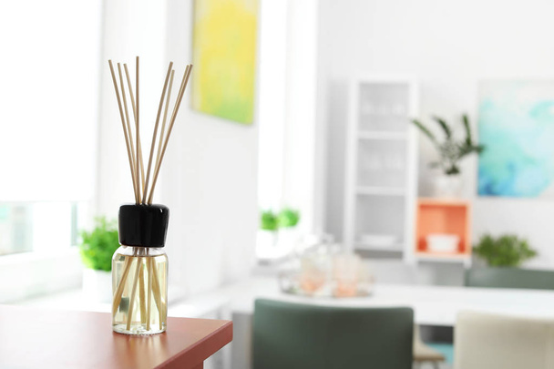 Aromatic reed air freshener on table in room - Фото, зображення