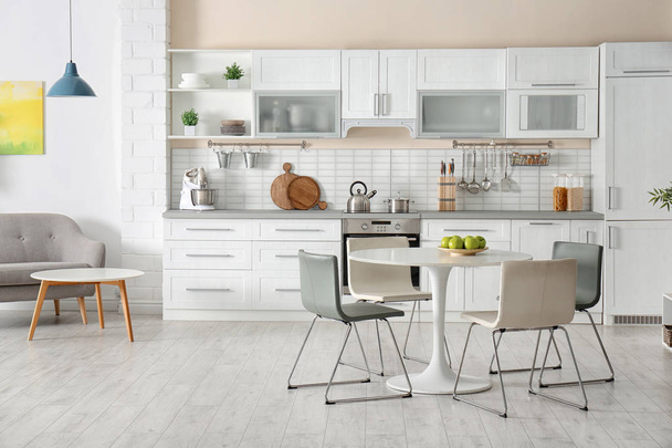 Stylish apartment interior with kitchen furniture and sofa - Foto, immagini