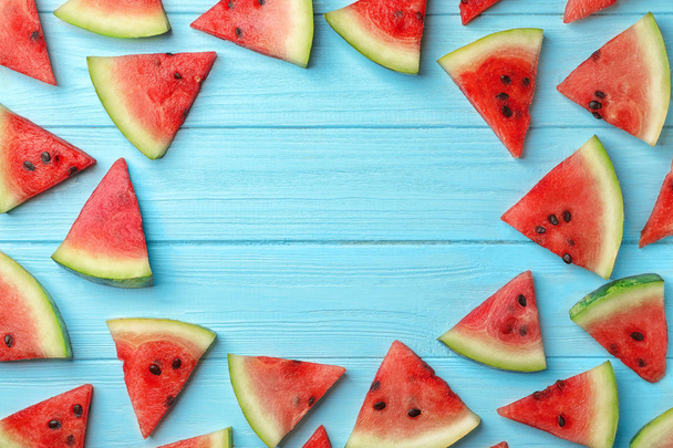 Slices of watermelon on wooden background, flat lay composition with space for text - Foto, immagini