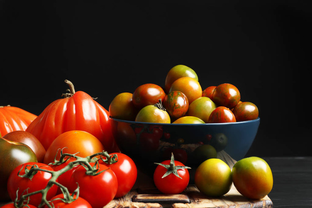 Composition with tasty juicy tomatoes on table - Foto, Imagen