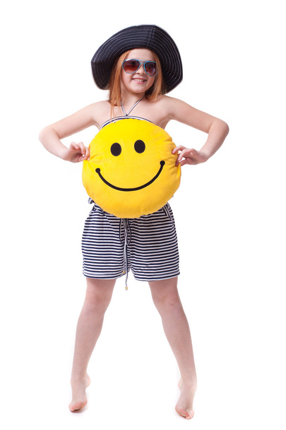 Beautiful young elementary age school girl with big yellow smile - Фото, изображение