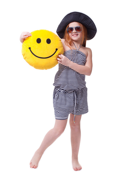 Beautiful young elementary age school girl with big yellow smile - Foto, imagen