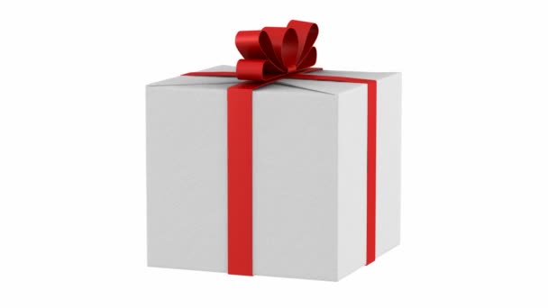 ajándék doboz-val piros szalag és íj hurok forgatni fehér háttér - Felvétel, videó