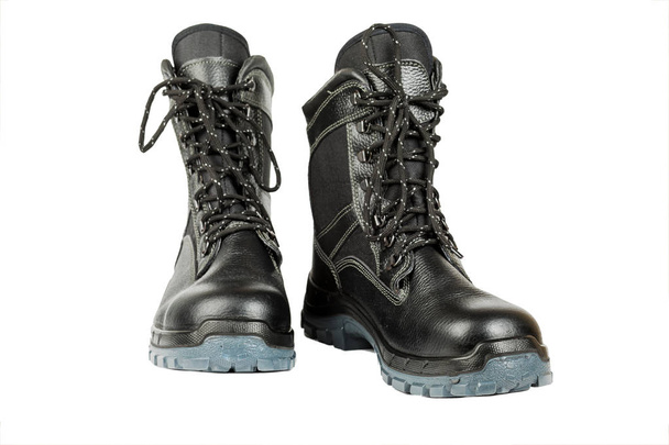 Black winter work boots isolated on white background. - Photo, Image