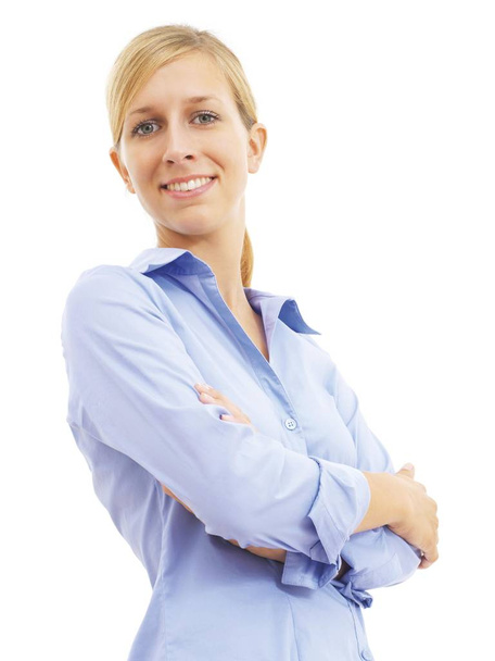 Caucasian woman smiling and looking at camera with crossed arms  - Foto, imagen