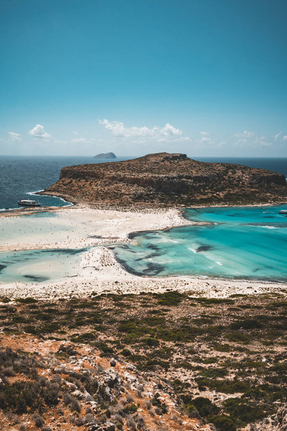 View of the beautiful beach in Balos Lagoon, and Gramvousa island on Crete, Greece. Sunny day, blue Sky with clouds. - Photo, image