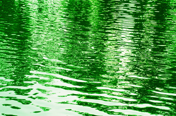 Abstract background of rippled water toned green - Photo, Image