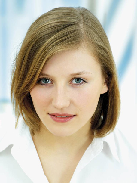 Young woman with short hair looking at camera - Zdjęcie, obraz