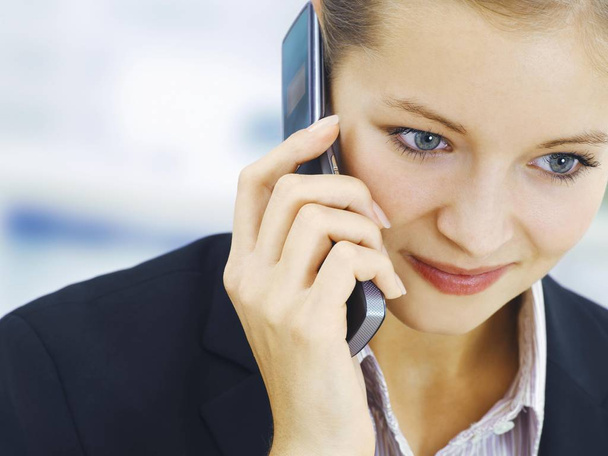 Businesswoman using a phone and calling  - Photo, Image