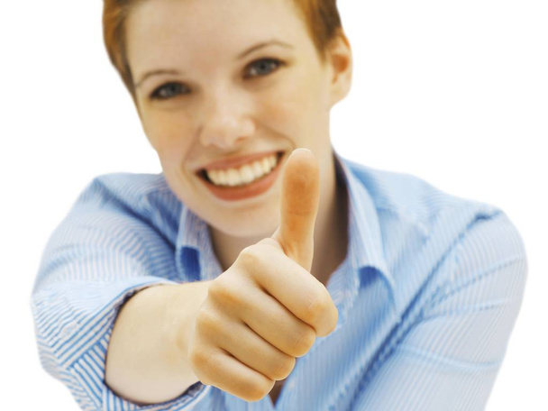 Businesswoman making thumbs up gesture - Foto, imagen