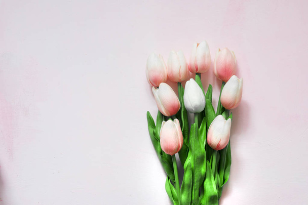 Bouquet of pink tulips on a light wooden painted background. Copy space made for greeting cards. Concept Mothers day. - Zdjęcie, obraz