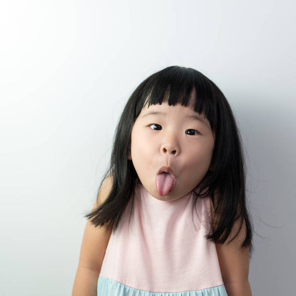 Happy little girl with funny face - Foto, imagen