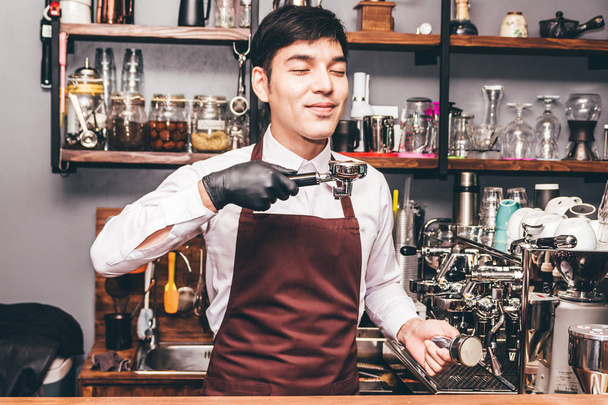 Man Barista using coffee machine for making coffee in the cafe - Photo, Image