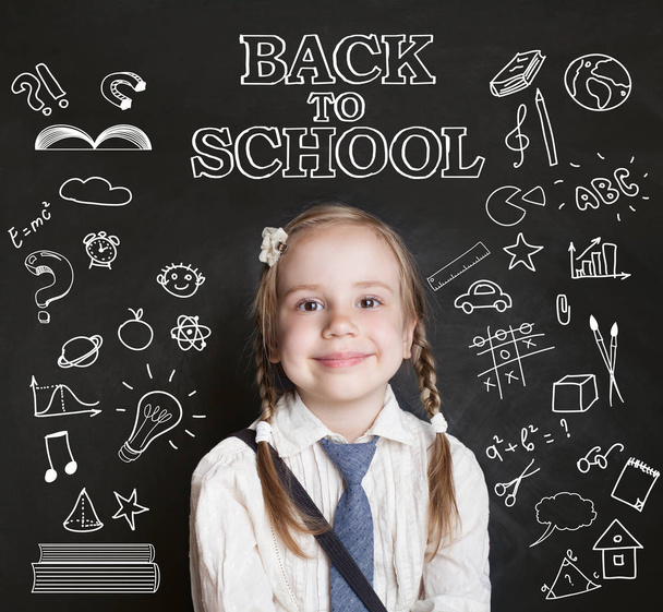 Happy pupil little girl in classroom on blackboard background and pattern with school supplies and creative elements. Back to school concept - Zdjęcie, obraz