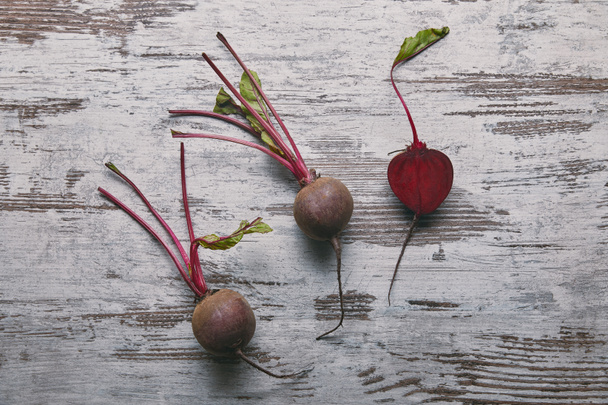 Small red beetroots on rustic wooden table - Photo, Image