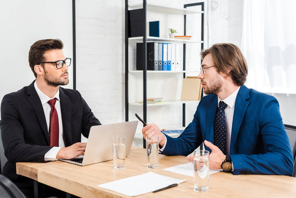 successful young businessmen having conversation at modern office - Zdjęcie, obraz