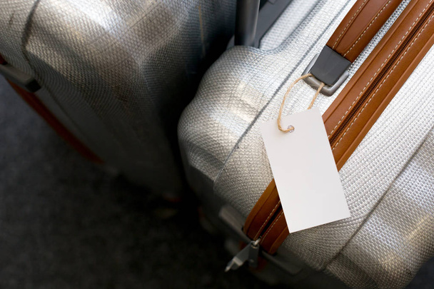 Close up of blank  luggage tag label on a suitcase  - Φωτογραφία, εικόνα