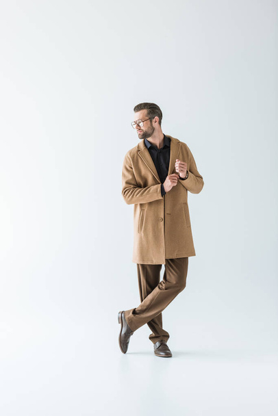 stylish man in brown autumn coat, isolated on white - Fotó, kép