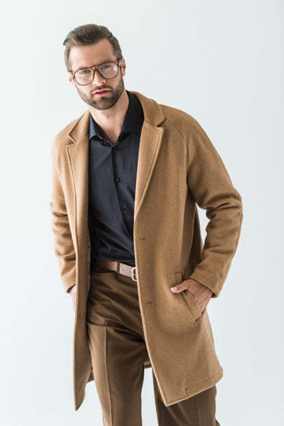 fashionable man in eyeglasses and brown coat, isolated on white - Foto, immagini
