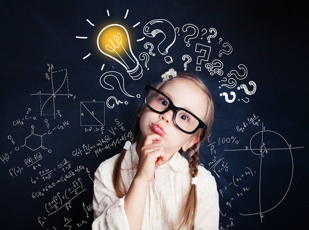 Small child mathematics student thinking on background with lightbulb and math formulas. Kid ideas - Photo, Image