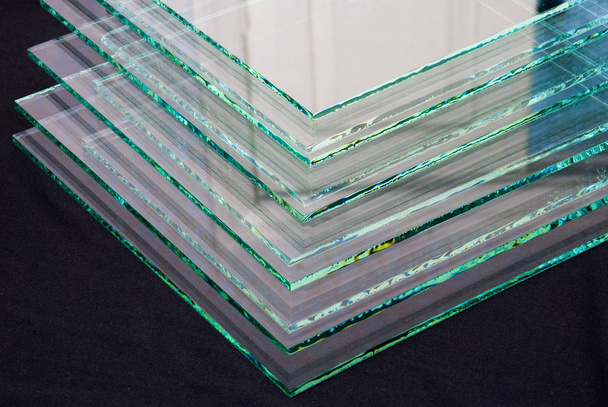 Sheets of Factory manufacturing tempered clear float glass panels cut to size. - Photo, Image
