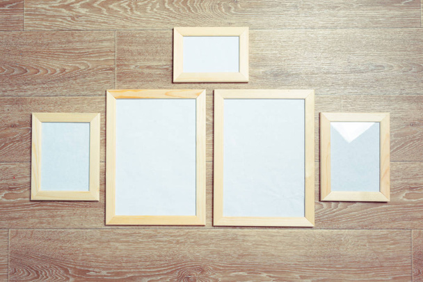  photo frames on the wooden wall - Foto, Bild