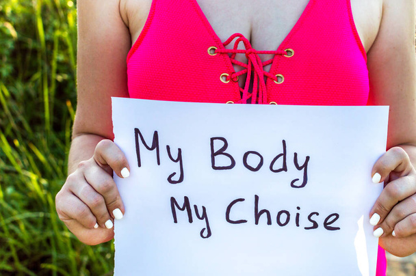 inscription of my body is my choice in the woman's hands close up. concept body positive - Photo, Image